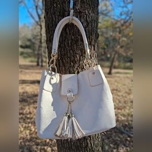 Elegant Cream Handbag with Tassel Accents